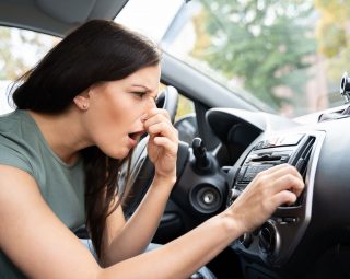 Woman Covering Her Nose From Bad Smell