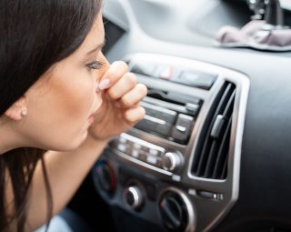 Woman Covering Her Nose From Bad Smell